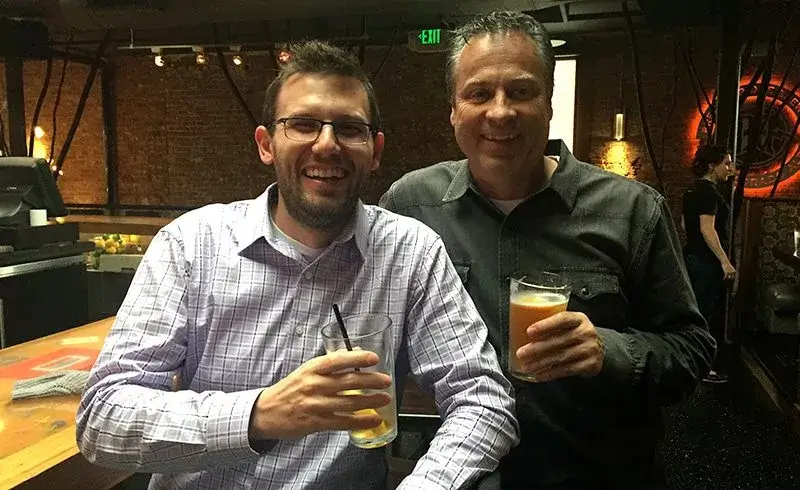 Two Men Having Drinks