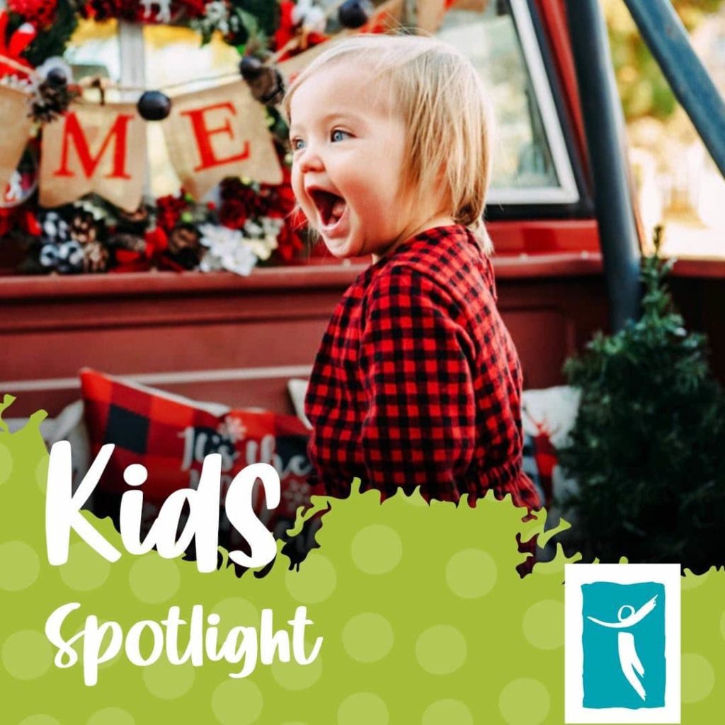 Cute child with green background that says Kids Spotlight