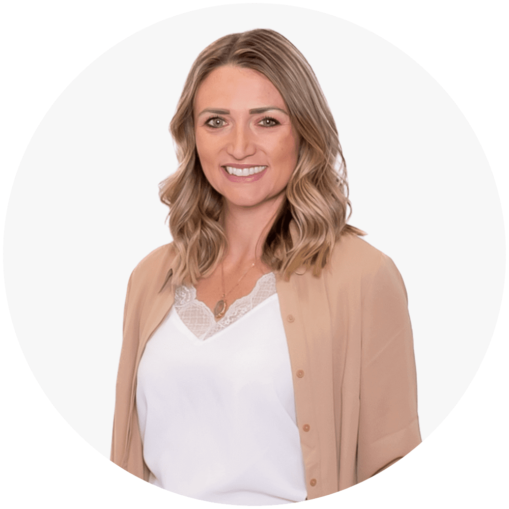 Woman smiling in a tan shirt